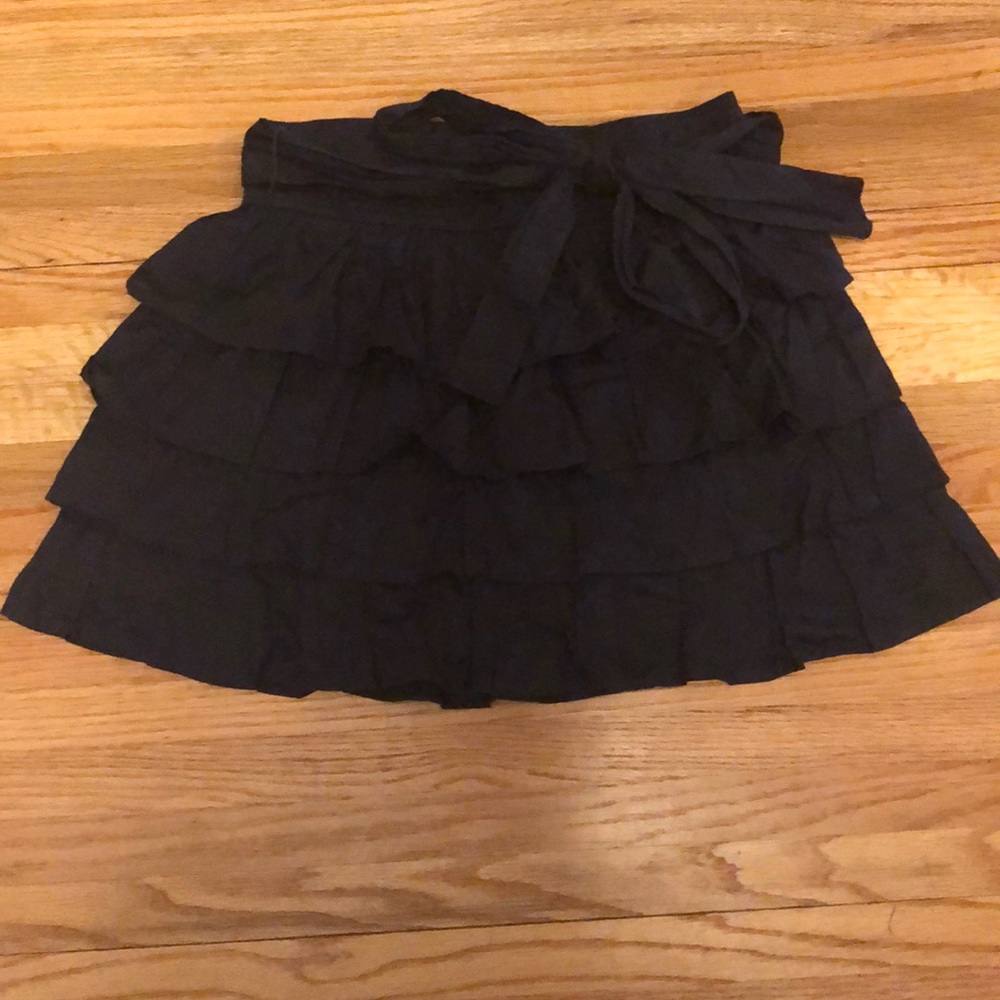Navy colored ruffle skirt with bow tie belt